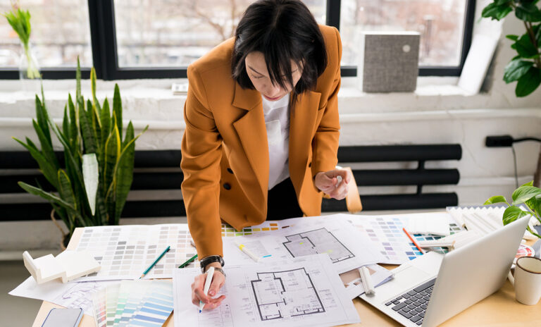 Woman,Architect,Working,On,Interior,Renovation,In,Workplace.,Designer,Choosing